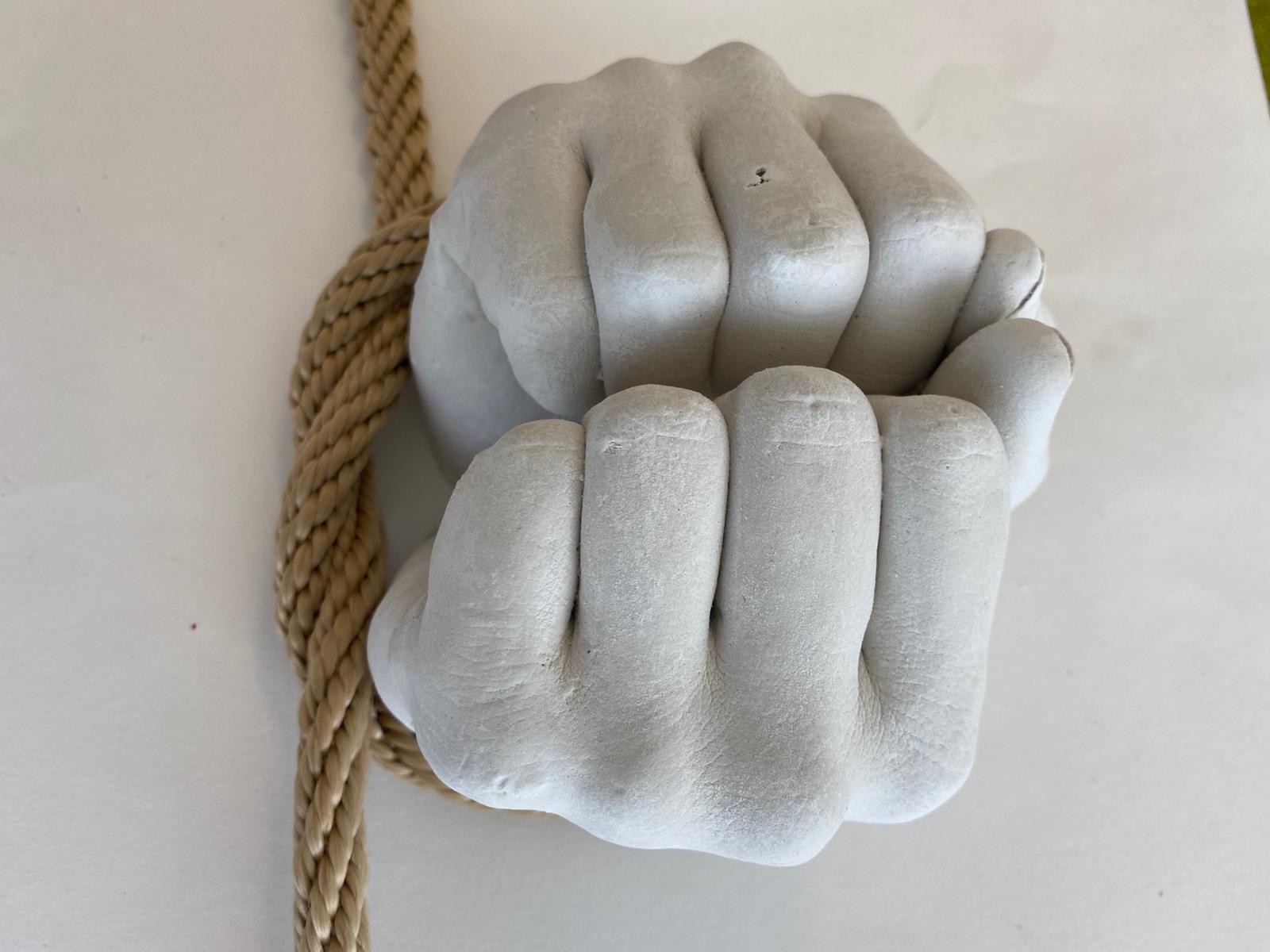 Plaster fists close up
