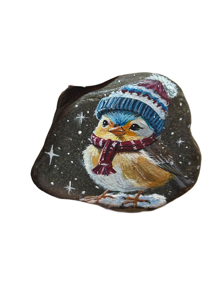 Small bird with hat and scarf painted on a stone