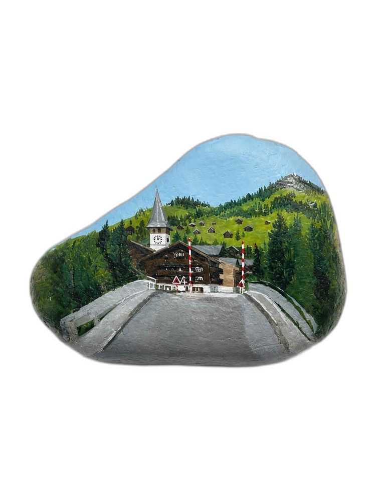 Swiss alpine village painted on a stone